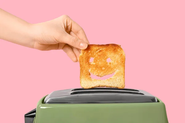 Woman Taking Funny Bread Slice Modern Toaster Pink Background — Stock Photo, Image