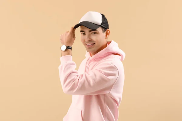 Stylish Young Man Hoodie Cap Beige Background — Stock Photo, Image