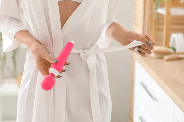 stock image Young woman with pink vibrator in bathroom, closeup