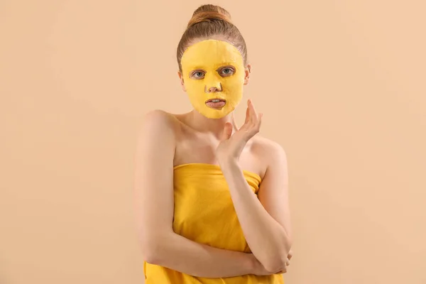 Young Woman Turmeric Sheet Mask Beige Background — Stock Photo, Image