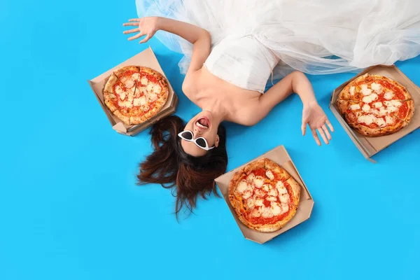 Young Woman White Dress Tasty Pizza Lying Blue Background Top — Zdjęcie stockowe
