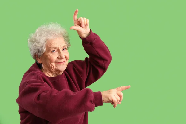 Senior Woman Showing Loser Gesture Green Background — Stock Photo, Image