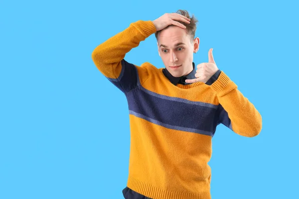 Young Man Showing Call Gesture Blue Background — Stock Photo, Image