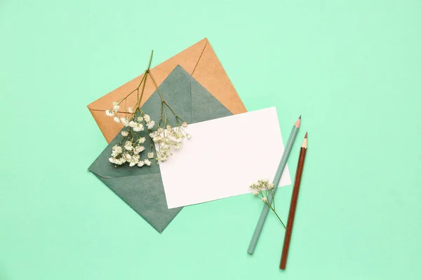 Composition Blank Card Envelopes Pencils Gypsophila Flowers Color Background — Stock Photo, Image