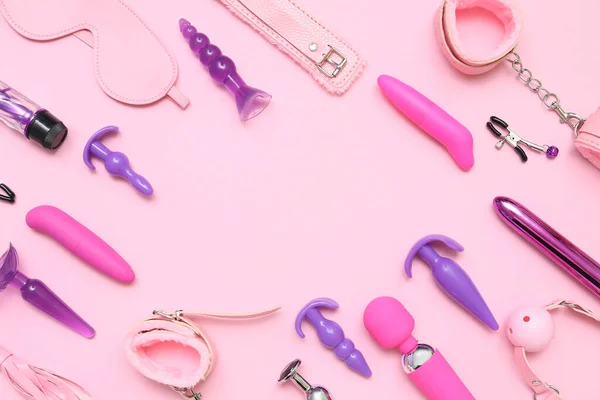 stock image Frame made of sex toys on pink background