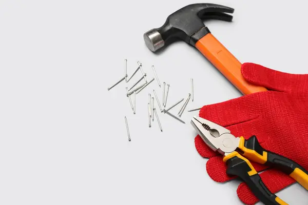 Pliers Glove Hammer Nails Grey Background — Stock Photo, Image