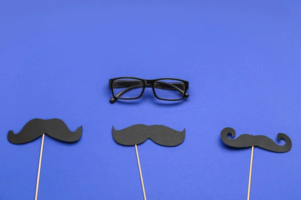 Wooden Sticks Paper Mustaches Eyeglasses Blue Background — Stock Photo, Image