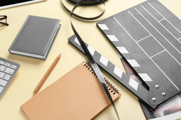 Notebooks Movie Clapper Film Reel Beige Background Closeup — Stock Photo, Image
