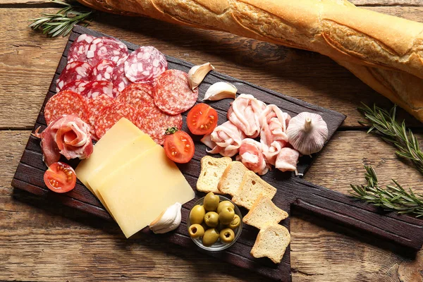 Board Assortment Tasty Deli Meats Cheese Wooden Background — Stock Photo, Image