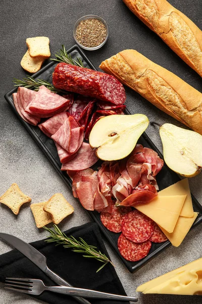 Board Assortment Tasty Deli Meats Cheese Bread Grunge Background — Stock Photo, Image