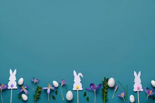 Composition Easter Eggs Paper Bunnies Beautiful Crocus Flowers Plant Leaves — Stock Photo, Image
