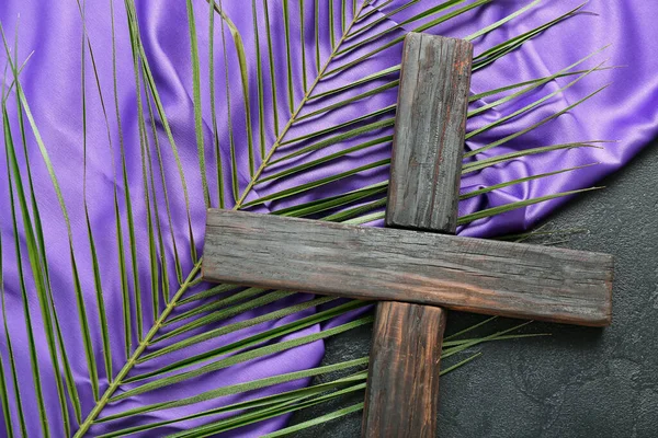 Wooden Cross Palm Leaf Purple Fabric Dark Background Closeup Good — Stock Photo, Image