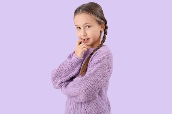 Little Girl Biting Nails Lilac Background — 스톡 사진