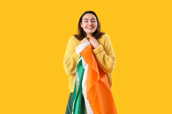 Happy Young Woman Flag Ireland Yellow Background — Stockfoto