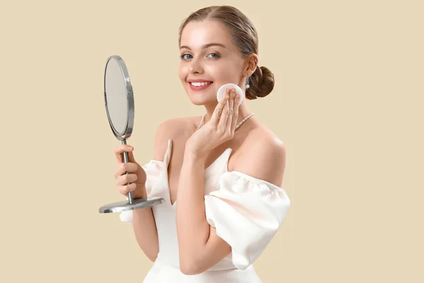 Young Woman Mirror Removing Makeup Beige Background — Stock Photo, Image