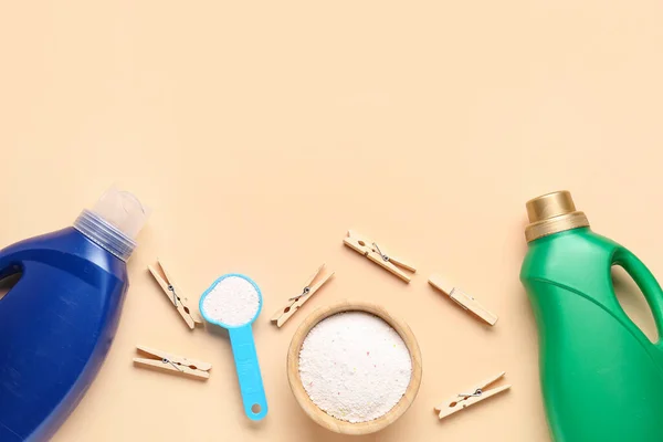 stock image Laundry detergents and clothespins on beige background