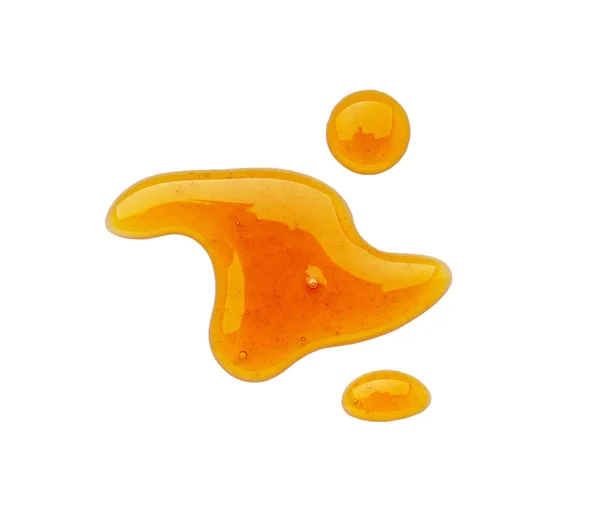 Spilled Maple Syrup White Background — стоковое фото