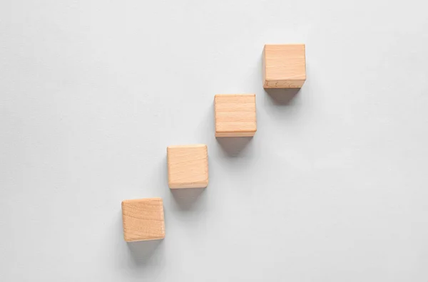 stock image Wooden cubes with check marks on grey background