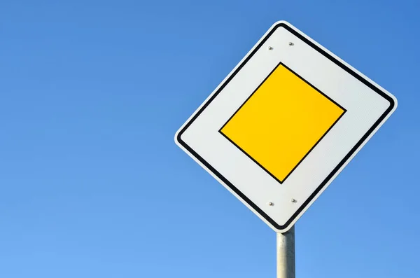 stock image Main road sign against blue sky, closeup