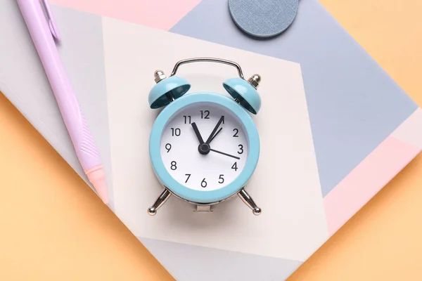 Notebook Pen Alarm Clock Color Background Closeup — Stock Photo, Image