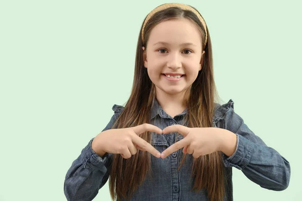 Cute Little Girl Making Heart Her Hands Green Background — Stock Photo, Image