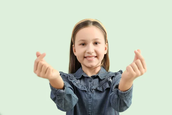 Cute Little Girl Making Heart Her Fingers Green Background Closeup — Stock Photo, Image