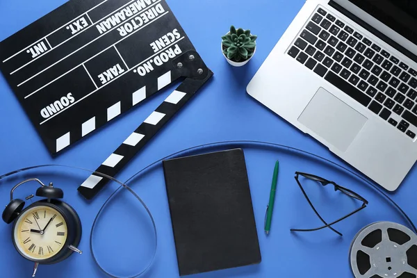 Notebook Movie Clapper Alarm Clock Film Reel Laptop Blue Background — Stock Photo, Image