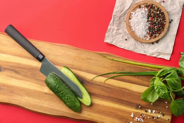 Wooden Board Cut Cucumber Herbs Spices Red Background Closeup — Stock Photo, Image