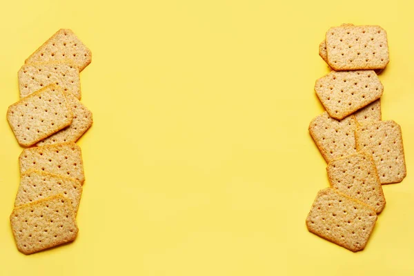 Frame Made Tasty Crackers Yellow Background — Stock Photo, Image