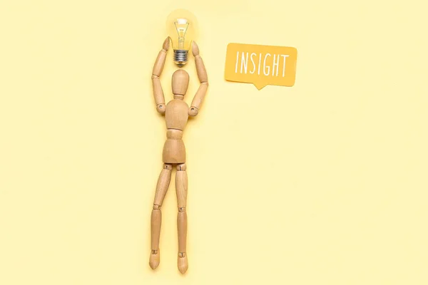 Wooden Mannequin Light Bulb Word Insight Beige Background — Stock Photo, Image
