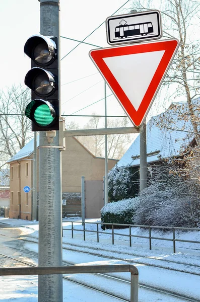 stock image View of traffic lights with signs in city on winter day