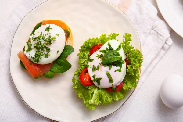 stock image Plate with tasty eggs Benedict on white table