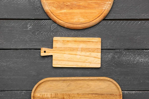 Set of kitchen boards on dark wooden background