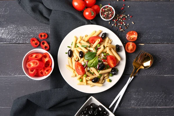 Plate Tasty Pasta Salad Ingredients Dark Wooden Background — Stock Photo, Image