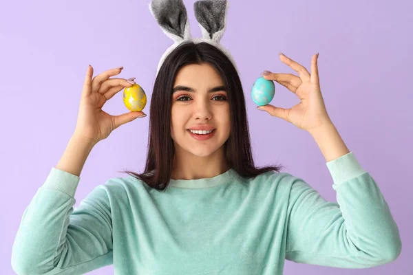 Young Woman Bunny Ears Easter Eggs Lilac Background — Stock Photo, Image