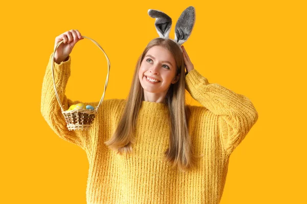 Young Woman Bunny Ears Basket Easter Eggs Yellow Background — Stock Photo, Image