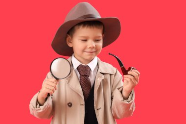 Cute little detective with magnifier and smoking pipe on red background