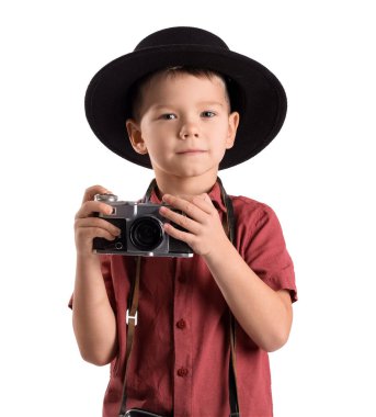 Cute little photographer with camera on white background