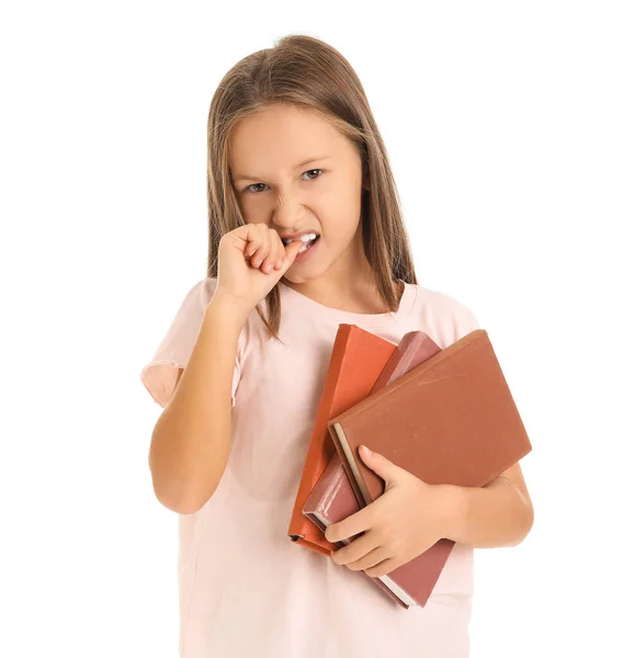 Angry little girl biting nails on white background