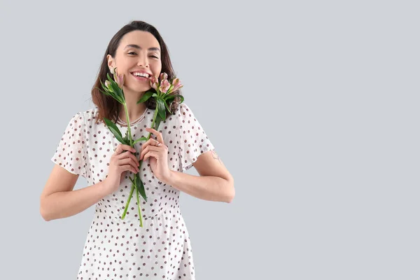 Young Woman Dress Alstroemeria Flowers Grey Background — Stockfoto