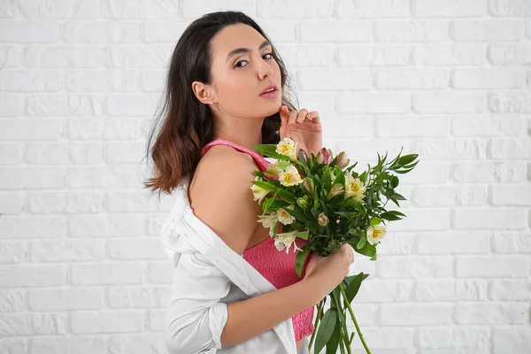 Young Woman Alstroemeria Flowers White Brick Background — Stock Photo, Image