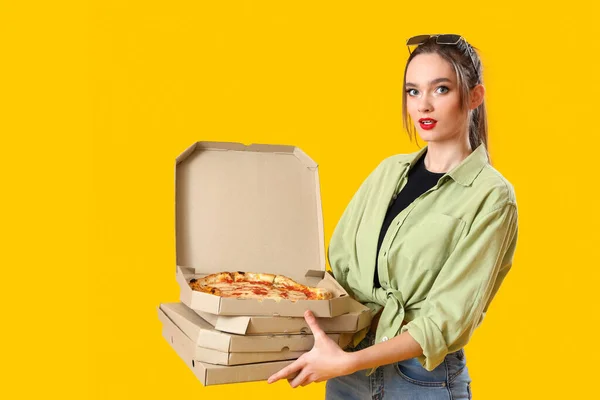 Young Woman Cardboard Boxes Tasty Pizza Yellow Background — Stock Photo, Image