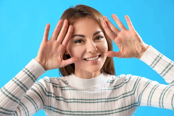 Beautiful Woman Showing Hands Blue Background Closeup — Stock Photo, Image