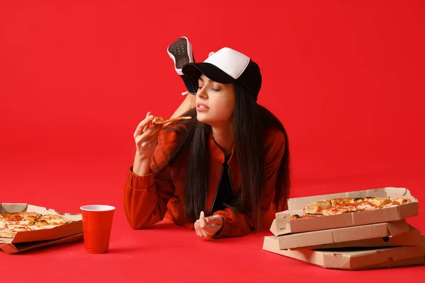 Young Woman Boxes Tasty Pizza Lying Red Background — Stock Photo, Image