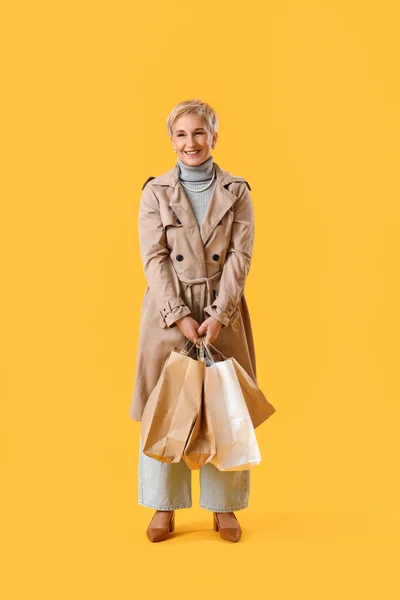 Beautiful Mature Woman Shopping Bags Yellow Background — Stock Photo, Image