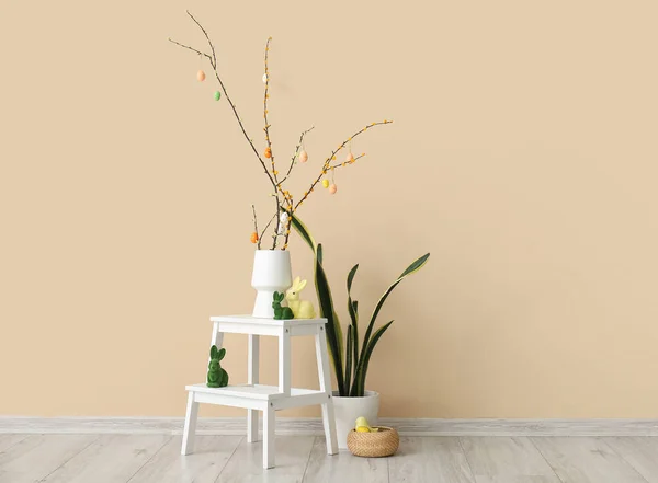 Vase Tree Branches Easter Eggs Toy Rabbits Stepladder Beige Wall — Stock Photo, Image