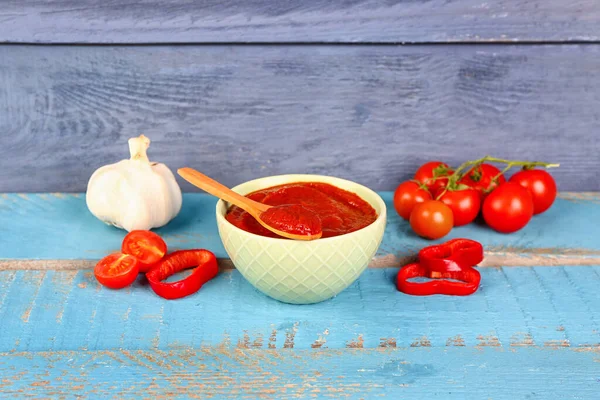 Bowl Tasty Tomato Paste Fresh Vegetables Blue Wooden Background — Stock Photo, Image