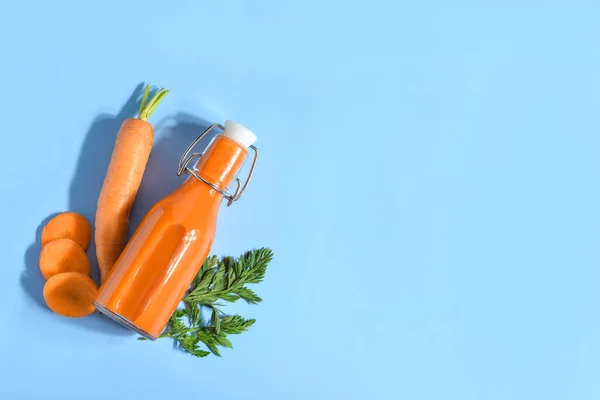 Glass Bottle Tasty Carrot Juice Blue Background — Stock Photo, Image