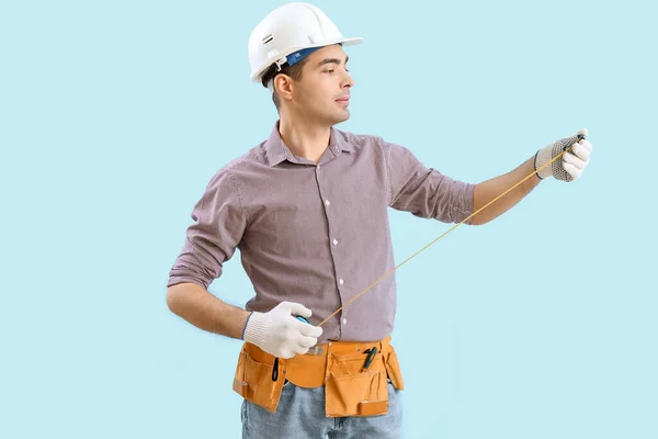 Young Carpenter Tape Measure Blue Background — Stock Photo, Image