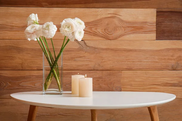 Burning Candles Vase Flowers Table Wooden Wall — Stock Photo, Image